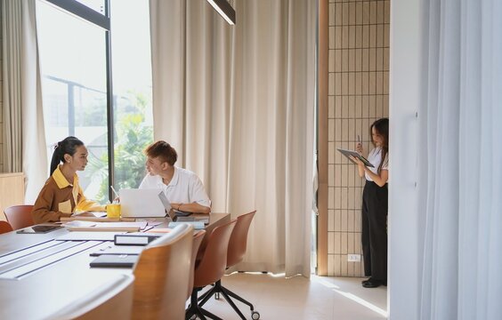 group of business people LGBTQ+ Diverse Team meeting collaborating new project in office