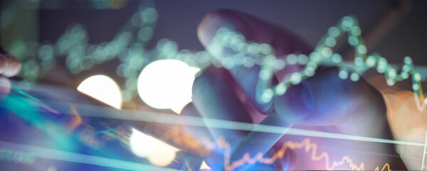 Analyzing financial data on a tablet with charts and graphs