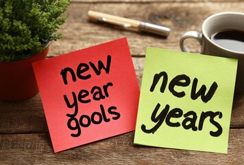 New year goals and new years written on vibrant sticky notes with coffee