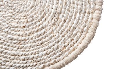 Woven beige rug corner; soft texture, rounded edge on black