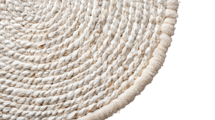 Woven beige rug corner; soft texture, rounded edge on black