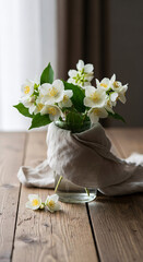 Fresh white jasmine flowers beautifully arranged on a wooden table