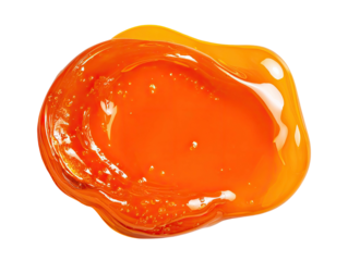 Shiny, glossy, orange liquid droplet isolated on a black background