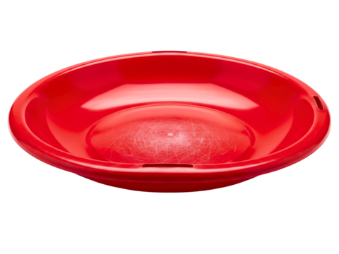 Round red plastic wash bowl with scratches on the inside surface on a transparent background