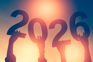 Happy new year 2026 silhouette with fireworks in the night sky.