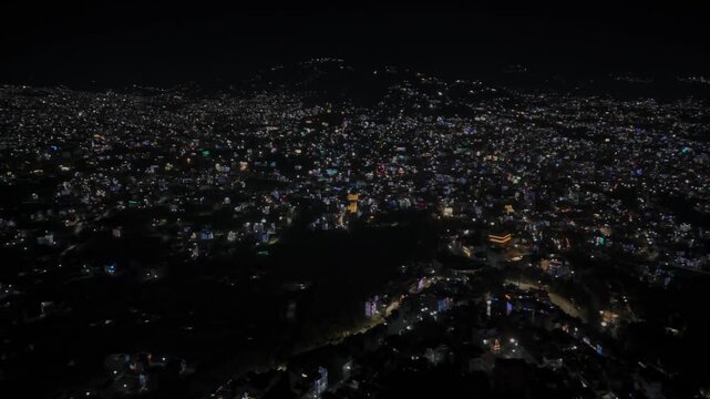 Aerial night footage of Kathmandu city during Diwali (Tihar), featuring the illuminated Dharahara Tower and glowing skyline filled with festive lights, showing Nepal&rsquo;s vibrant cultural celebration.