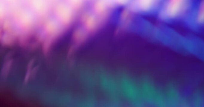 Defocused luminosity. Leak lens. Neon color light kaleidoscopic reflection spin texture. Purple blue violet fluorescent abstract background.