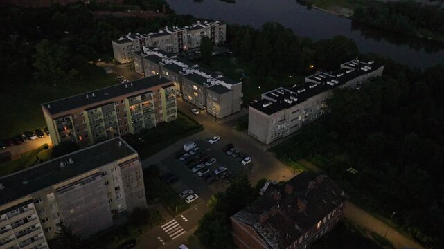 Aerial night scene showing apartment blocks and river in Nowy Dw&oacute;r Mazowiecki