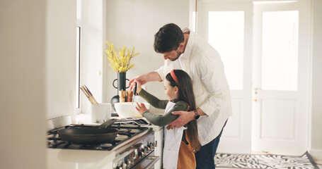 Baking, ladle or teaching with father and daughter in kitchen of home for bonding or development....