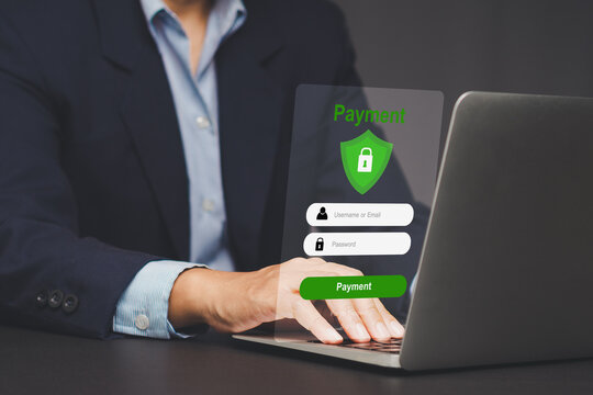 Businessman using laptop for secure online payment system.