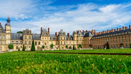 Discover the majestic Fontainebleau Palace, a historic French site featuring exquisite architecture and beautiful gardens. Ideal for tourism and historical exploration.