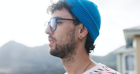 Thinking, outdoor and man view sunrise for inspiration, morning reflection or holiday perspective. Calm observation, weekend travel or person with glasses for insight, vacation or ideas with space