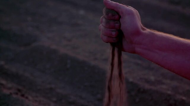 Textured fertile soil as background. Black compost fertilizer for planting plants. Top view of compost soil background. The soil is rich in minerals, suitable for cultivation. Gardening season.