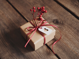 Rustic Kraft Paper Gift Box Tied with Red Ribbon and Heart Charm