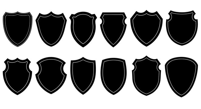 Collection of various black silhouette shield shapes isolated on white background