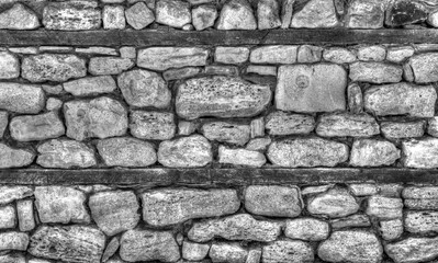 Stone wall background in black and white close up view