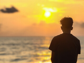 man watching sunset alone