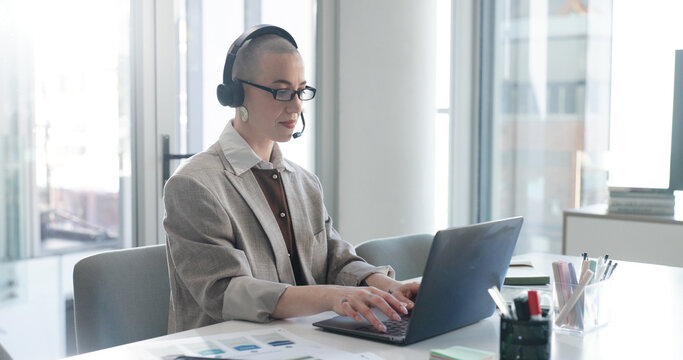 Woman, headset and laptop at office, financial review and customer support at investment company. Mature person, broker or advisor with computer, voip tech and feedback for stock market at agency