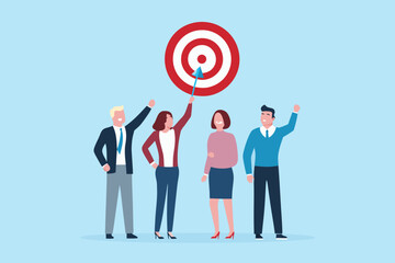 Diverse team celebrating hitting their business target with an arrow in the bullseye of a dartboard