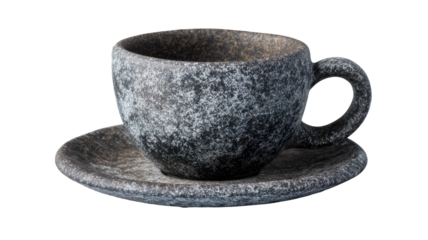 Speckled ceramic cup with curved handle and saucer on black background