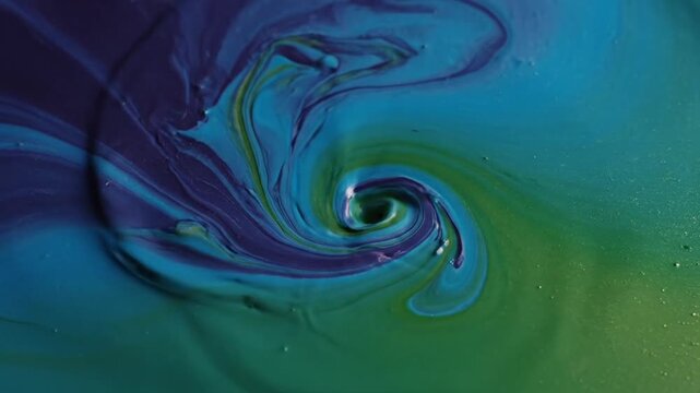 Whirlpool of Blue Teal and Green Paint Mixing in Fluid Motion Creating an Abstract Swirl Pattern Under Bright Studio Lighting for Adobe Stock Photo