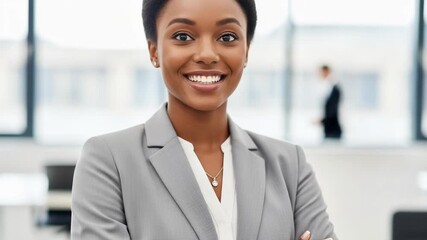 Smiling businesswoman in a grey suit with arms crossed - Powered by Adobe