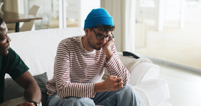 Support, anxiety and friends on sofa with conversation, comfort and understanding in discussion together. Mental health, stress or men in house with help, empathy or advice in emotional communication