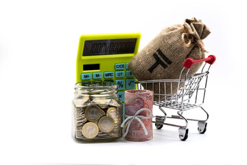 5,000 Kazakhstani tenge banknotes and a glass jar with 100 Kazakhstani tenge coins