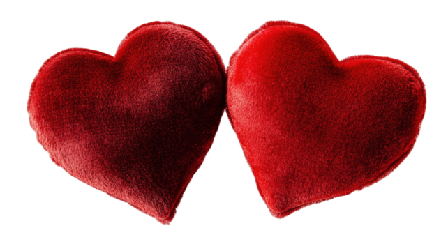 Two red velvet hearts with soft texture and romantic appearance symbolizing love and affection, isolated on white background