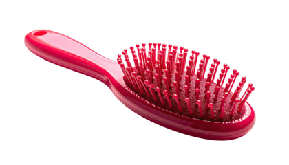 Hot pink oval hairbrush with bristles isolated against black