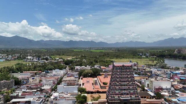 Aerial view of Tenkasi&rsquo;s iconic Kasi Viswanathar Temple surrounded by a mix of modern and traditional buildings, while the town stretches out towards hills and rocky outcrops in the background