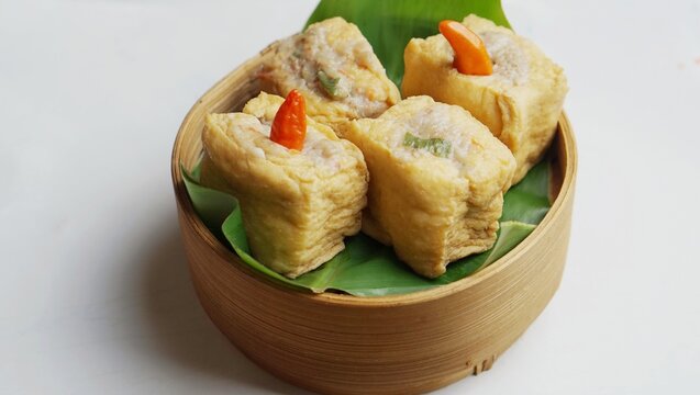 Asian food. Tahu Bakso in the bamboo plate. Tahu bakso with chilli