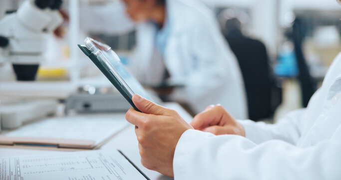 Person, hands or research with tablet in laboratory for medical analysis, news or breakthrough. Employee, scientist or scrolling with technology, documents or healthcare study for cure or development - Powered by Adobe