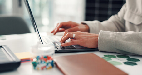 Online, typing and hands with laptop in office, employee or eco friendly report for risk...