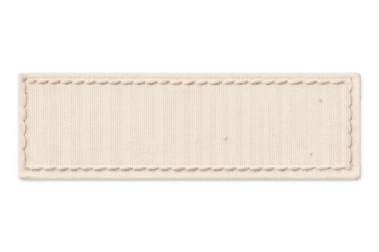 Blank beige fabric tag in rectangle shape, stitched border, empty textile label for clothing branding