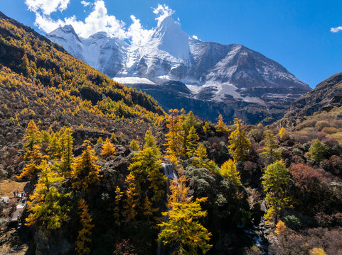 Aerial view of hikers trekking in autumn landscape of Daocheng Yading, Sichuan, China