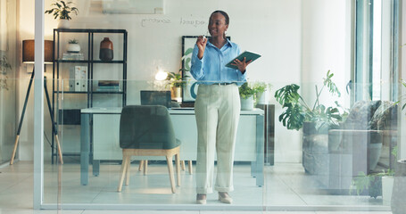 Black woman, writing or planning with tablet on glass board for schedule, agenda or tasks in...