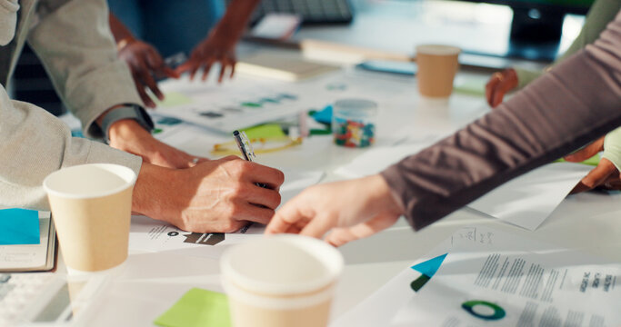 Business people, hands and meeting with documents for planning or project brainstorming in office. Group, employees or designers with paperwork or ideas for tasks, agenda or campaign in workplace