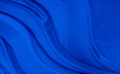 Black blue satin dark fabric texture luxurious shiny that is abstract silk cloth background with patterns soft waves blur beautiful.