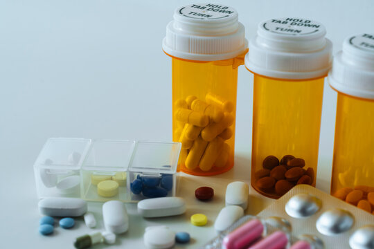 Medicine bottle and pill with blister packaging used in pharmacy and health care. Ideal of drug treatment, supplement or vitamin and pharmaceutical marketing and industry. Healthcare concept