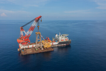 Fototapeta premium Decommissioning oil and gas vessel is used to safely dismantling and removing infrastructure from a field after production ends.