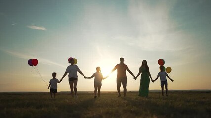Happy family group holding balloons. Parents and children in group with colorful balloons. Happy Family bonding with balloons. Joyful group of family with balloons. Happy Family group fun with. - Powered by Adobe