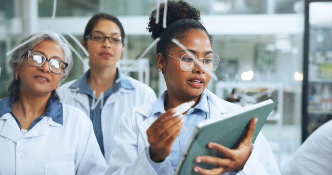 Science, glass wall and people in lab with tablet, collaboration or notes for pharmaceutical study. Medical, team or researcher in clinic with board, problem solving or analysis in dna investigation. - Powered by Adobe