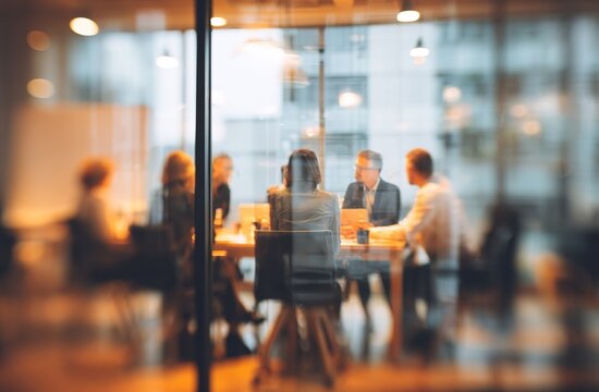 Blurred diverse business people meet in conference room. Corporate team sitting at table at seminar, discussing financial strategy, marketing plans. Blurred office interior, window view for - Powered by Adobe