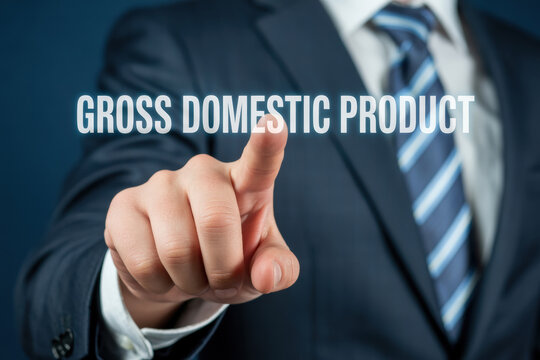 Businessman pointing to glowing text gross domestic product highlighting economic indicators and financial terms