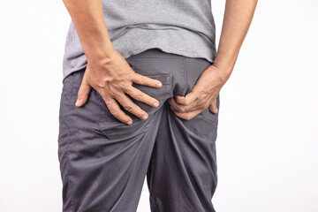 Hemorrhoidal pain, man with hemorrhoids on white background.