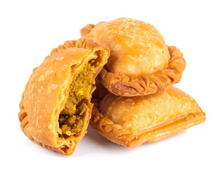 Close-up of golden-brown savory pastries with flaky crust and filling