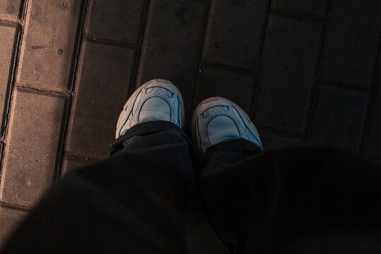 sneakers on sidewalk