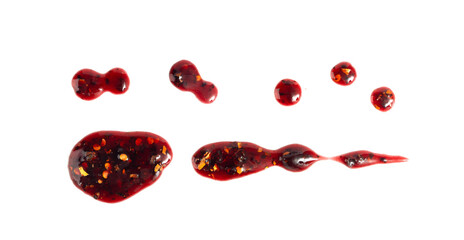 Black currant jam with chili isolated, blueberry chilli pepper marmalade smear, spicy fruit confiture