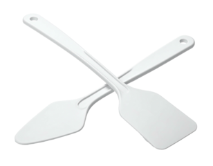 Crossed white spatulas, offset on black